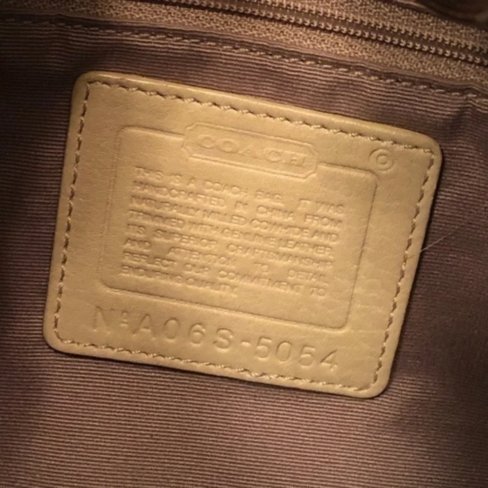 Coach cream pebbled leather perforated hobo bag